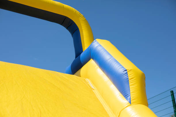 istock Inflatable obstacle course for fun. Inflatable structure in the park. 1323369104