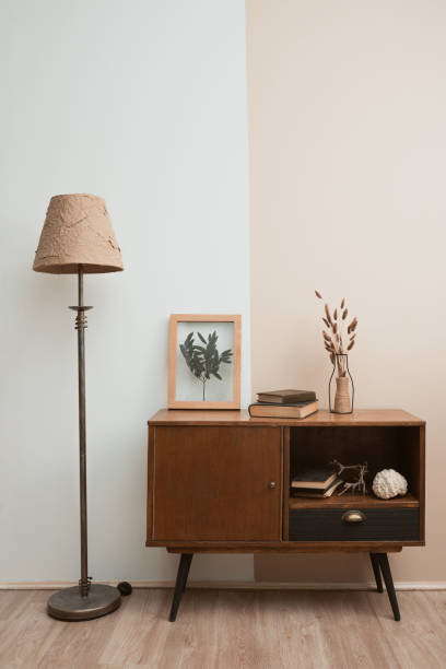 istock Dry flowers in a frame. walls with botanical leaves. Eco-friendly boho decor. 1323369211