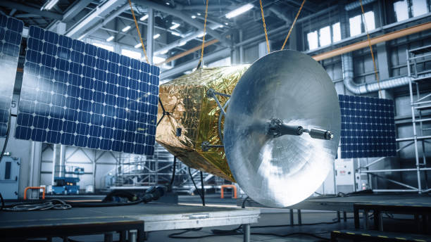 istock Satellite Under Construction in Aerospace Technology Manufacturing Facility. Development of Spacecraft for Space Exploration, Navigation, Communications, Internet Telecommunication, Observation 1323369487