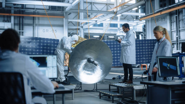 istock Engineer and Technician Working on Satellite Construction. Aerospace Agency: Diverse Team of Scientists Using Technological Equipment and Tablet Computer to Develop Spacecraft for Space Exploration 1323369489