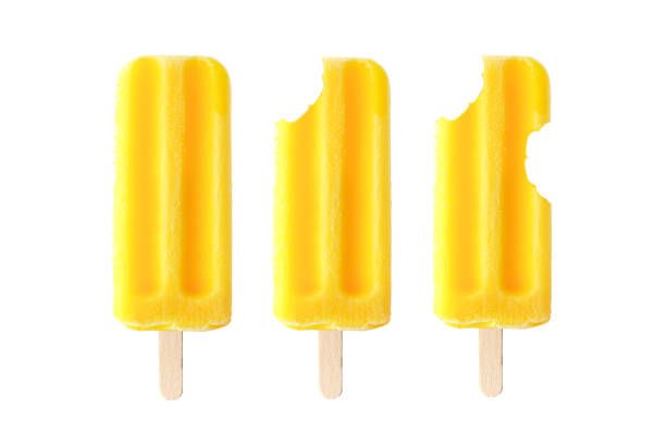 Yellow ice pops with increasing number of bites removed isolated on a white background