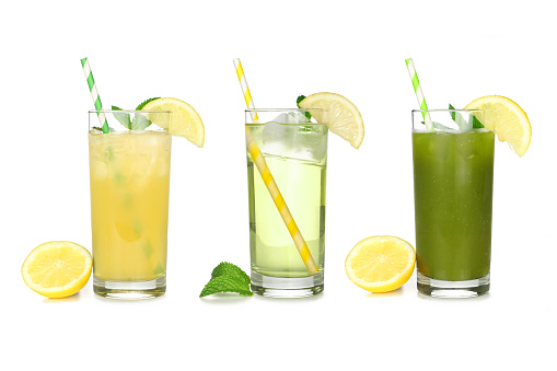 Set of summer iced green teas in glasses with paper straws isolated on a white background. Iced green tea lemonade, iced green tea and iced matcha lemonade.