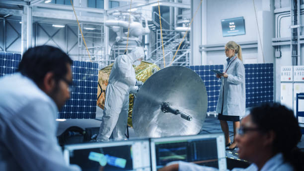 istock Female Engineer uses Computer to Analyse Satellite, Calculate Orbital Trajectory Tracking. Aerospace Agency International Space Mission: Scientists Working on Spacecraft Construction. 1323369750