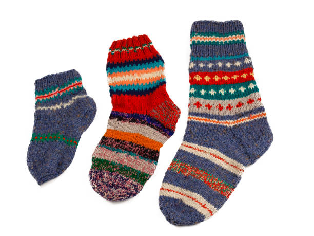 istock Knitted socks isolated on white background. Warm multi-colored wool sock. Set 1323371987