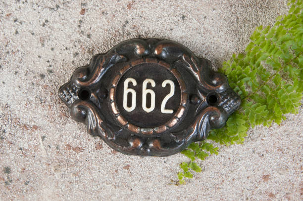 istock Old metal home number sign 1323372061