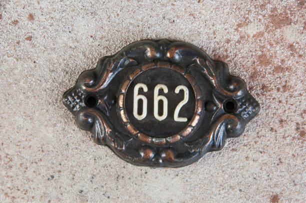 istock Old metal home number sign 1323372070