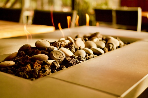 Sepia-toned indoor outdoor fireplace, fire pit