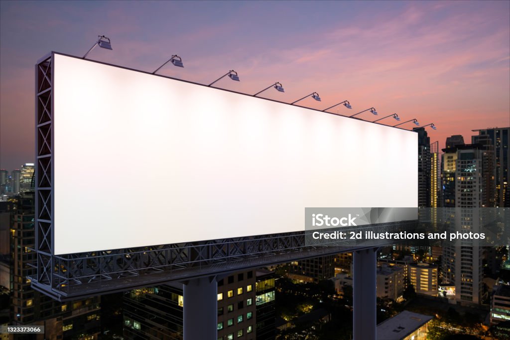 Blank white road billboard with Bangkok cityscape background at night time. Street advertising poster, mock up. Side view. The concept of marketing communication to sell idea. Billboard Stock Photo