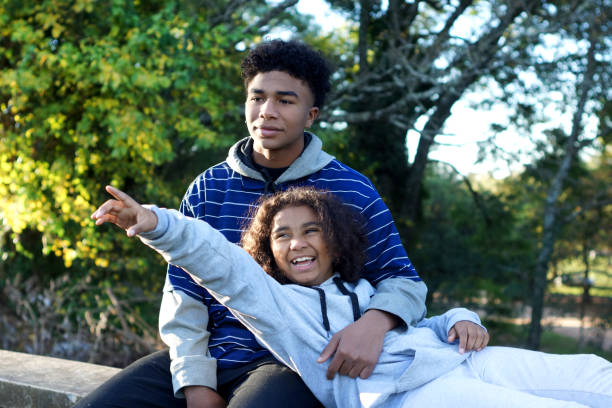 istock brothers hugged outdoors 1323373312
