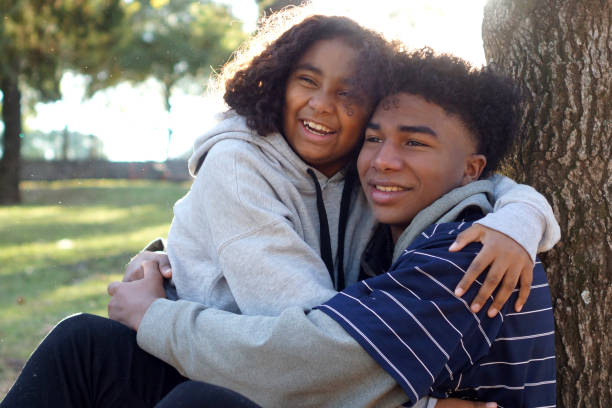 istock brothers hugged outdoors 1323373585