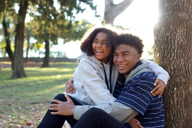 istock brothers hugged outdoors 1323374147