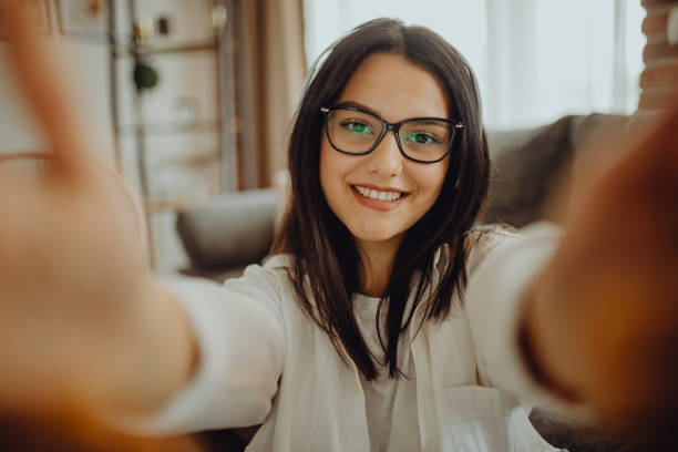 istock A young female student sitting on thek couch using laptop headphones when studying 1323374321