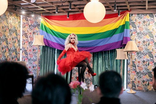 Latin drag queen from bogota Colombia between 30 and 39 years old, presents her theatrical work to her followers during the performance inside the theater on the day of gay pride