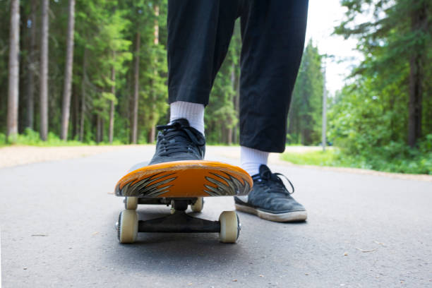 istock young man rides a skateboard in the park 1323381501