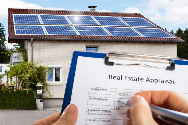 istock Person Hand Filling Real Estate Appraisal Document 1323382739