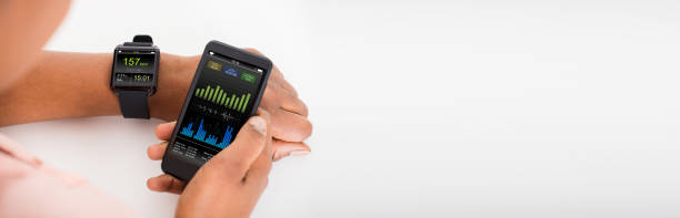 istock Hand With Mobile And Smartwatch Showing Heartbeat Rate 1323382793