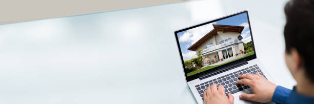 istock Selecting New House On Laptop 1323382809