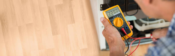 istock Repairman Checking Fridge With Digital Multimeter 1323382814