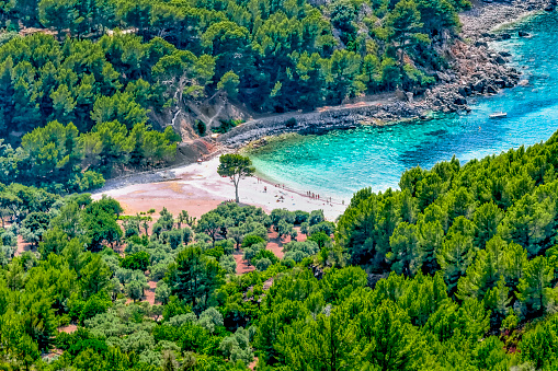Cala Tuent is a bay with a stony beach in the northwest of the Balearic island of Majorca. It is located in the municipality of Escorca below the Puig Major, the highest mountain of the Tramuntana mountains at 1445 meters
