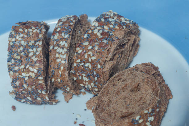 istock Sliced rye bread, sprinkled with poppy seeds, sesame seeds, flaxseed 1323385284