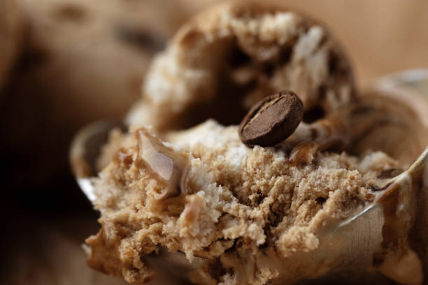 istock Ice cream brown texture background with coffee bean 1323385371