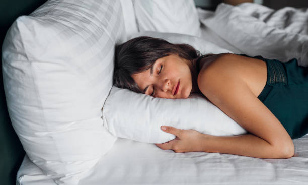 Beautiful Woman Sleeping in Bed