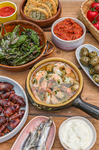 Summer Table with variety of Spanish Tapas Food Plates