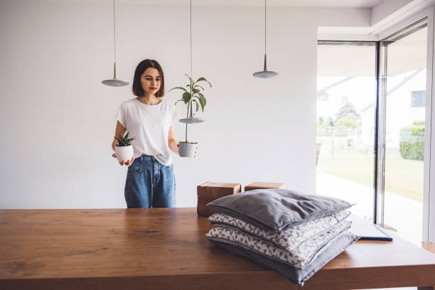 istock Young woman moving into a new apartment 1323390493