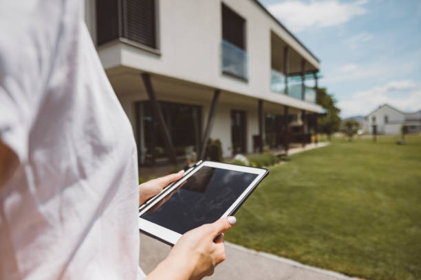 istock Estate agent listing a property on a digital tablet 1323390516