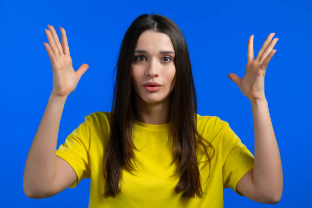 istock Young woman showing invisible abstract big subject or object. Large concept. 1323392414