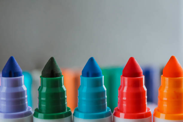 istock Colorful rainbow markers with blurred background. Close view 1323395310