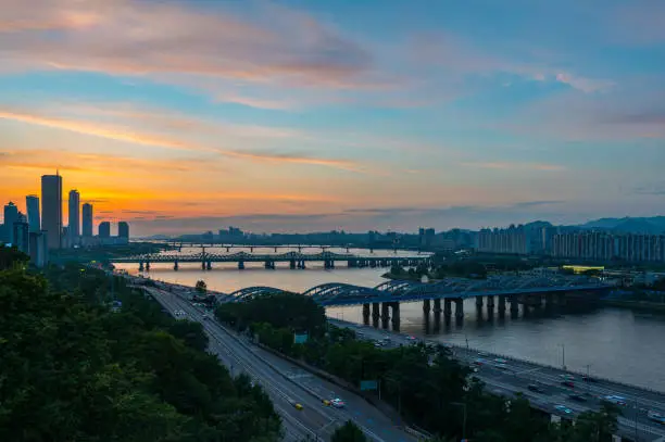 sunset view of 63 building and nodeul island  and  han river bridge traffic cars driving, seoul city attractions, south korea
