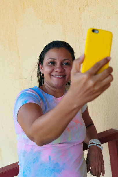 istock Woman over 40, taking a selfie with a smartphone 1323398445
