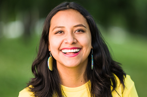 South American real latin female happy headshot with background