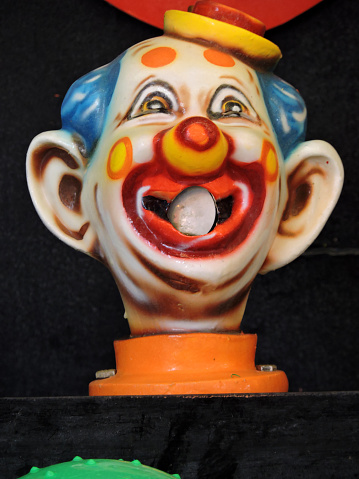 Close up of a clown head in a carnival game.