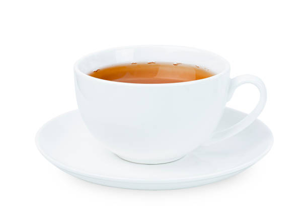 cup of tea white mug with tea on a white isolated background. front view tea cup and saucer stock pictures, royalty-free photos & images