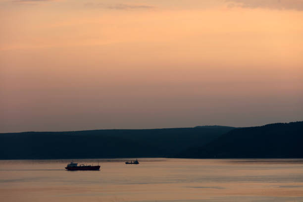 Logistics and transportation of International Container Cargo ship on Sunset