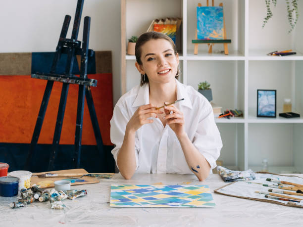 istock art class painting skill smiling artist in studio 1323410180