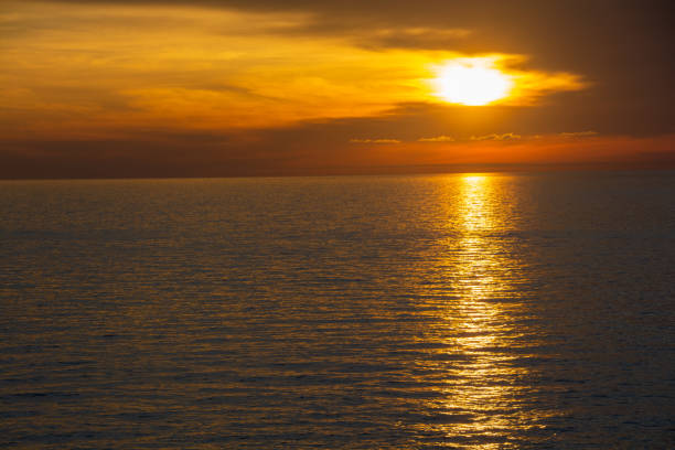 istock Beautiful dusk sea and orange sky 1323412216