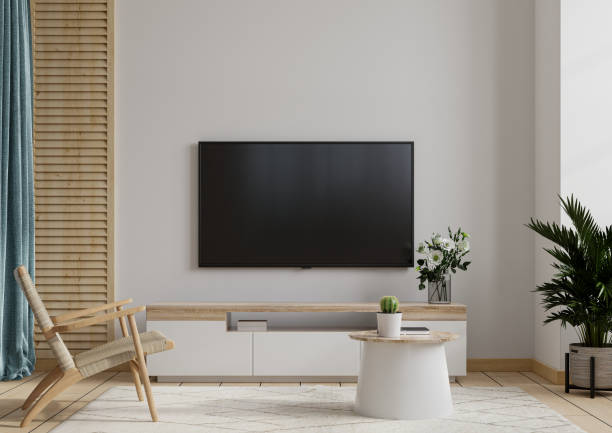 istock TV lounge with armchair on white wall background. 1323418164
