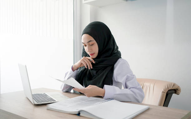 istock Young muslim student writing and learning in the room. E-learning online education. 1323420943