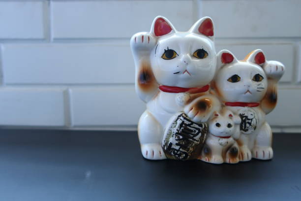 istock A white Japanese figurine cat beckoning 1323421730