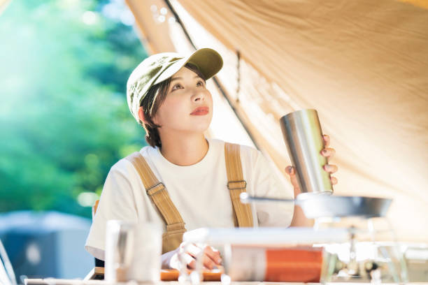 istock Young woman drinking alcohol outdoors 1323424783