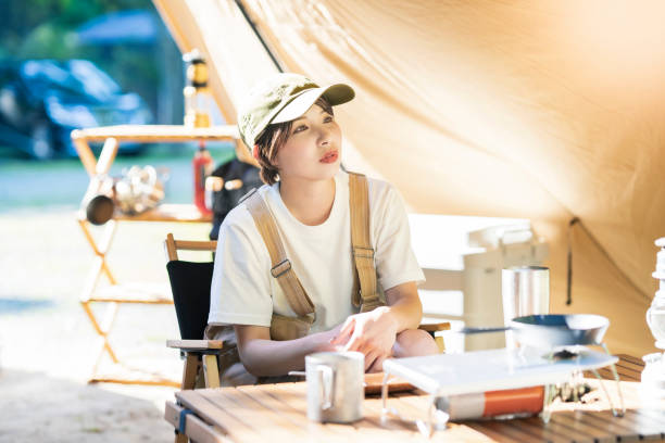 istock A young woman relaxing in a tent 1323426613
