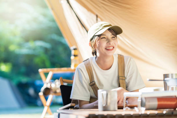 istock A young woman relaxing in a tent 1323426701
