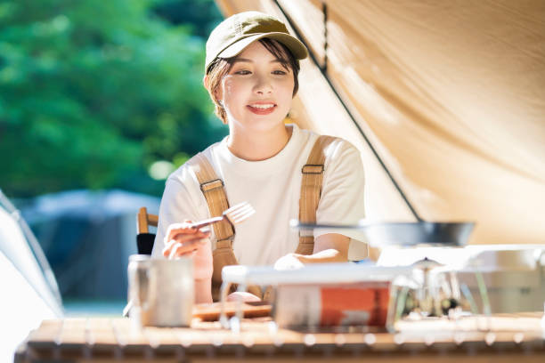 A young woman relaxing in a tent