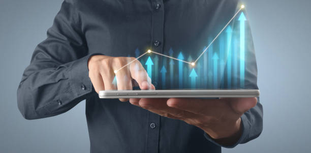 istock Plan graph growth increase of chart positive indicators in his business on tablet 1323428250