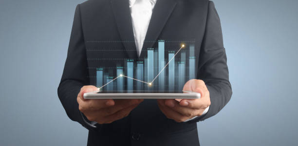 istock Plan graph growth increase of chart positive indicators in his business on tablet 1323428253