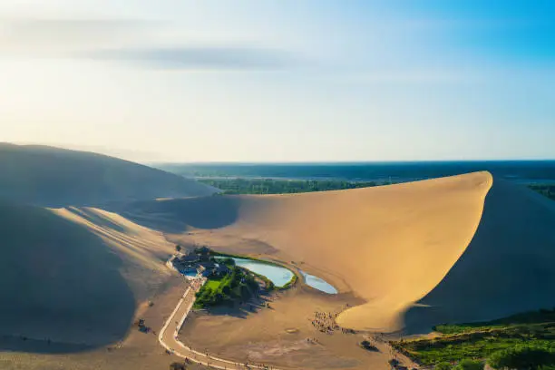 Photo of Yueya spring Scenic Area, Mingsha Mountain, Dunhuang City, Gansu Province, China. Gansu Dunhuang Crescent Lake and Mingsha Mountain,China.