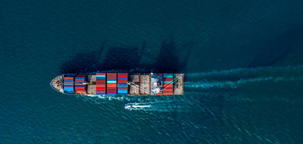 istock Aerial view container ship global business logistics import export worldwide, Container cargo ship commercial trade transportation open sea, Container cargo freight shipping. 1323430131